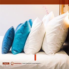 MOONDA pillows arranged on a bed